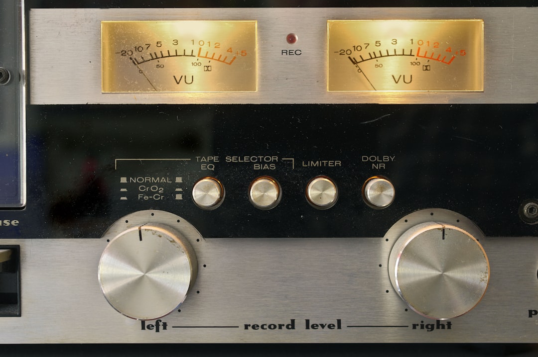 Close-up of vintage audio equipment VU meters and control knobs