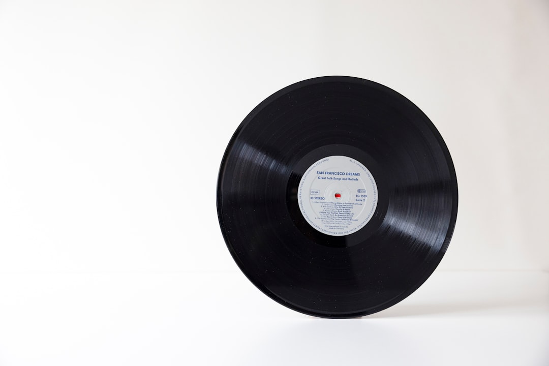LP record on turntable platter with record weight stabilizer